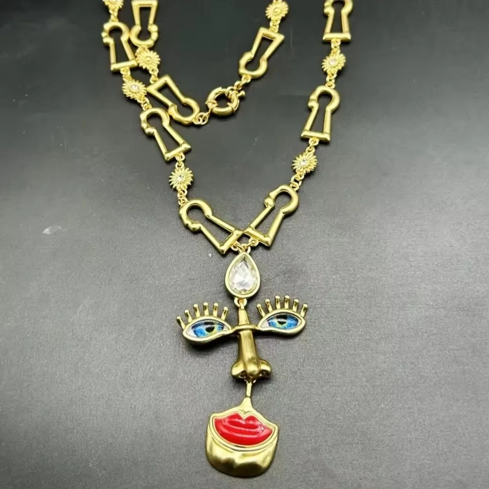 Gold-tone Abstract Face Pendant Necklace with Red Lips - Picture 3 of 5